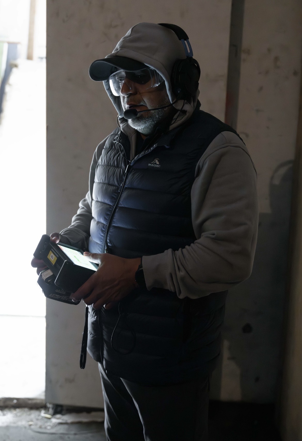 Instructor operating the Touchscreen Remote Control during a live exercise